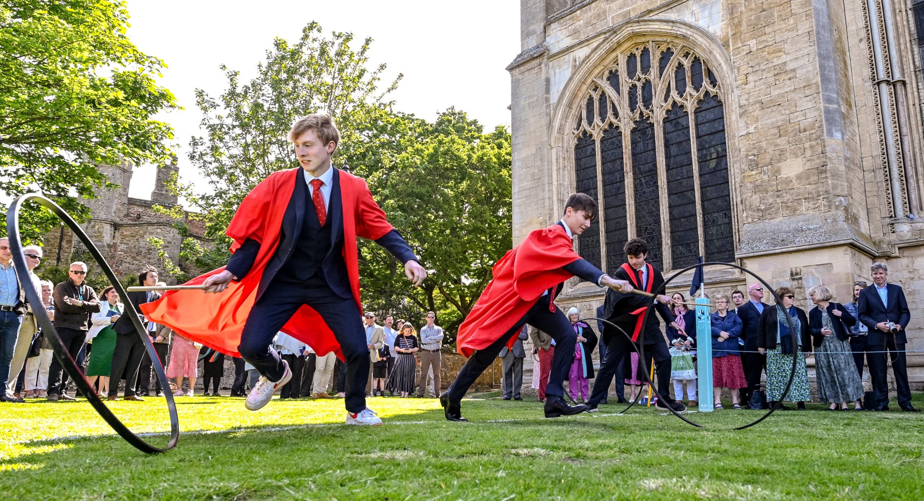 King's Ely students doing the Hoop Trundle outside Ely Cathedral 